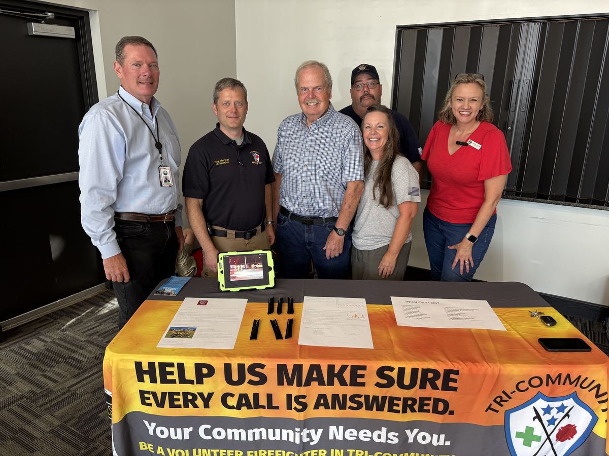 Hamilton County Commissioner Jeff Eversole with Tri-Community Volunteer Fire Department volunteers at their recruiting table at the August 31 volunteer fair