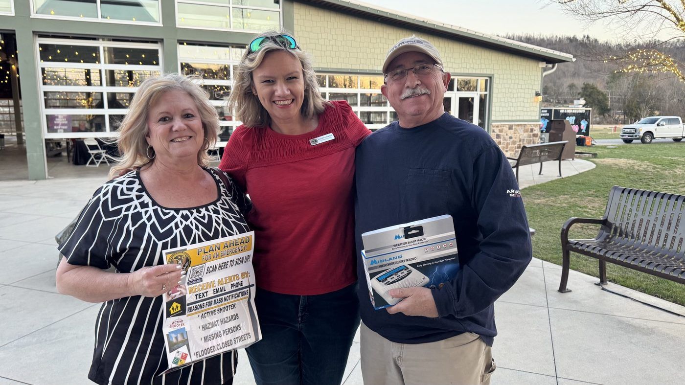 Laura sharing emergency-alert sign-ups and weather radios with residents at Storm Safety Day
