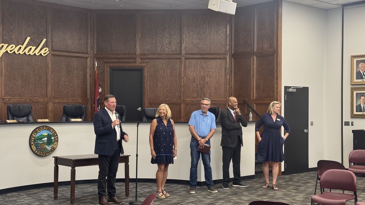Guests standing together to take resident questions at the June 29 Community CARE meeting